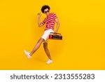 Small photo of Full length photo of cool funky guy dressed red t-shirt dark glasses dancing enjoying boom box songs isolated yellow color background