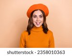 Small photo of Photo of optimistic funky girl lady enjoy free time weekend rest make faces fool foolish tongue out isolated on beige color background