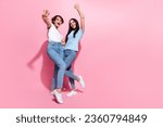 Small photo of Full body photo of two careless girls sisters have fun shopaholic celebrate black friday discount offer isolated on pink color background