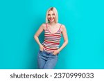 Small photo of Photo portrait of lovely young lady arms pockets jeans posing defile wear trendy striped garment isolated on cyan color background