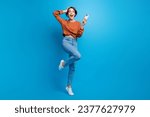 Full body photo of pretty young girl hold telephone amazed sales hold device wear trendy brown outfit isolated on blue color background
