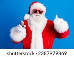 Photo portrait of retired old man hold car electric key thumb up wear trendy santa claus costume coat isolated on blue color background