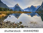 First light on Mitre Peak and surrounding mountains at Milford Sound, Fiordland, in New Zealand's South Island.