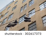 Shoes Hanging On Power Lines In ...