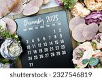 December 2023 monthly calendar with flower bouquet decoration on marble background