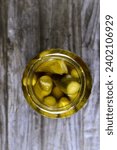 Small photo of pickled cucumber, pickle, gherkin, usually small or miniature cucumber that has been pickled in a brine, vinegar, or other solution and left to ferment, part of mixed pickles and food appetizers