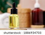 bottle of yellow cosmetic oil... | Shutterstock . vector #1886934703
