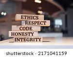 Small photo of Wooden blocks with words 'ethics, respect, code, honesty, integrity'. code of conduct