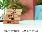 Wooden blocks with words 'Do not break the rules!'.