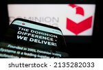 Small photo of Stuttgart, Germany - 03-06-2022: Mobile phone with website of company Dominion Voting Systems Corporation on screen in front of business logo. Focus on top-left of phone display. Unmodified photo.