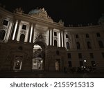 Small photo of Vienna, Austria - 03-19-2022: Night view of the Spanische Hofreitschule (Spanish Riding School) in the Hofburg in the historic center of Vienna, Austria with illuminated facade and fiacre.