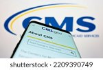 Small photo of Stuttgart, Germany - 09-22-2022: Smartphone with website of Centers for Medicare and Medicaid Services (CMS) on screen in front of logo. Focus on top-left of phone display. Unmodified photo.