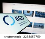 Small photo of Stuttgart, Germany - 04-01-2023: Cellphone with logo of think tank IISD institute on screen in front of website. Focus on center of phone display. Unmodified photo.