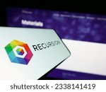 Small photo of Stuttgart, Germany - 07-19-2023: Mobile phone with logo of American company Recursion Pharmaceuticals Inc. on screen in front of business website. Focus on left of phone display. Unmodified photo.