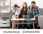 Small photo of Trouble couple with unhappy child teenager discussing problems in worry family. Conflicts marital couple with kids crisis. Sad father and mother with sad daughter teenager.