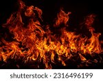 Small photo of Fire blaze flames on black background. Fire burn flame isolated, abstract texture. Flaming explosion with burning effect. Fire wallpaper, abstract art pattern with copy space.
