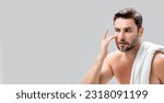 Small photo of Banner of man with perfect skin touch face after shaving. Skin care healthcare cosmetic procedures concept. Close up man looking in mirror, sensitive skin, cosmetology treatment. Skin care.