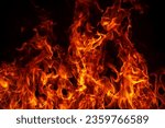 Small photo of Fire blaze flames on black background. Fire burn flame isolated, abstract texture. Flaming explosion with burning effect. Fire wallpaper, abstract art pattern with copy space.