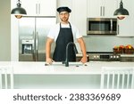 Small photo of Chef on kitchen. Professional chef man in uniform on kitchen. Bearded chef, cook or baker. Male chef over kitchen background. Handsome man in chefs uniform with chefs hat cooking in the kitchen.