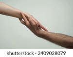Small photo of Helping hand. Holding hands, close up. Giving a helping hand. Rescue, helping gesture or hands. Salvation relations. Support hand. Help hand gesture, sign of help and hope. Helping arm, charity.