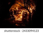 Small photo of Fire flame home. House fire. Burning building. Open flames. Burning house. Single family detached home completely destroyed by flames. Blaze fire flame home. House fire. Burning building.