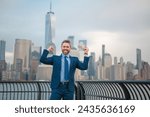 Small photo of Mature Businessman with dollars money. Excited man with dollar money on street. Rich business man in suit hold dollar cash. Businessman hold 100 dollars banknotes at city. Dollars banknote.
