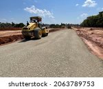 Small photo of 7 Oct 21 - KB, Malaysia : A roller compactor is compressing a crusher run at site. A roller is used to compact soil, gravel, concrete, or asphalt in the construction of roads and foundations.
