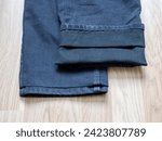 Small photo of Ways to shorten jeans. Shortening pants to length without cutting. Tailors advice