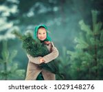 Girl Holding A Christmas Tree