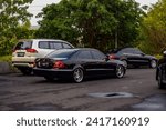 Small photo of Surakarta Indonesia November 12 2023 black Mercedes-Benz E 280 W211 in Mercedes-Benz national jamboree 2023