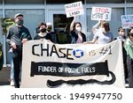 Small photo of BRENTWOOD, M0.-April 3, 2021: Environmental Activist hold sign "Reading "Chase Bank is #1 funder of fossil fuels" at a protest of the installation of Enbridge Energy's line 3 pipeline replacement.