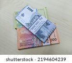 Small photo of New issuance of Indonesian Rupiah Banknotes in 2022. Rupiah banknotes with a nominal value of one thousand, two thousand and five thousand. Semarang-Indonesia, August 2022