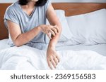 woman have problem with dust mites allergy bedding hand scratching her itchy and rash skin 