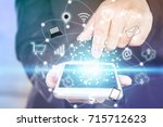 business woman hand touching on smart phone screen with technology icon iot 
( internet of things) 
