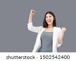 Small photo of Young professional Asian woman raising her arms up feeling cheerful triumphant happiness and successful celebrating business or successful job, the concept of successful emotional, Clipping path embed