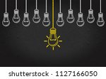 light bulbs on a blackboard... | Shutterstock .eps vector #1127166050