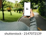 Small photo of Girl in the park holding a smartphone with Nike Training Club NTC app on the screen. Rio de Janeiro, RJ, Brazil. March 2022.