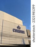 Small photo of June 19, 2023, Talca, Chile: Corina brand logo sign on a modern building on blue sky