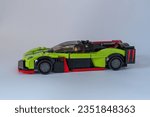 Small photo of Doha, Qatar - August 24, 2023: LEGO Speed Champions Aston Martin Valkyrie AMR Pro car isolated on white background.