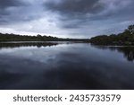 Small photo of dusk over wooli wooli river running through a body of water in nsw australia