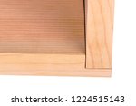 Small photo of Close-up of two boards forming a woodworking rabbet or rebate joint isolated against a white background