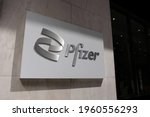 Small photo of New York City, NY, US - April 20, 2021: The Pfizer building logo and nameplate on 42nd Street. Pfizer has been distributing its COVID-19 vaccine.