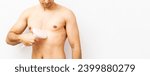 Small photo of An unrecognizable shirtless young man poses on a white background while using a pulsed light machine on his torso to eradicate hair. Pulsed light hair removal concept. IPL. Laser hair removal in men.