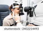 Small photo of An unrecognizable ophthalmologist uses a slit lamp with a camera to examine a woman's eye. Biomicroscope.Eye health concept. Observation of the surface of the anterior pole of the eyeball