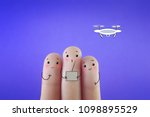 Three fingers decorated as three friends playing with drone.