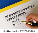 Small photo of One person is answering question about vaccines. He needs pneumococcal conjugate vaccine.