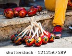 Small photo of Handicraftsman making and selling maracas at the walled city in Cartagena de Indias