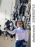 Female tourist taking selfies at the Vargas Swamp Lancers memorial located near Paipa city in Boyacá. Realized by Colombian artist Rodrigo Arenas Betancourt and by engineer Guillermo Gonzalez Zuleta.