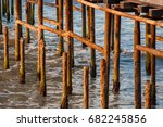 Ocean and rusty dock pilllars