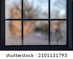 Close-up of a leaded double glazed window with condensation inside on after a very cold night
